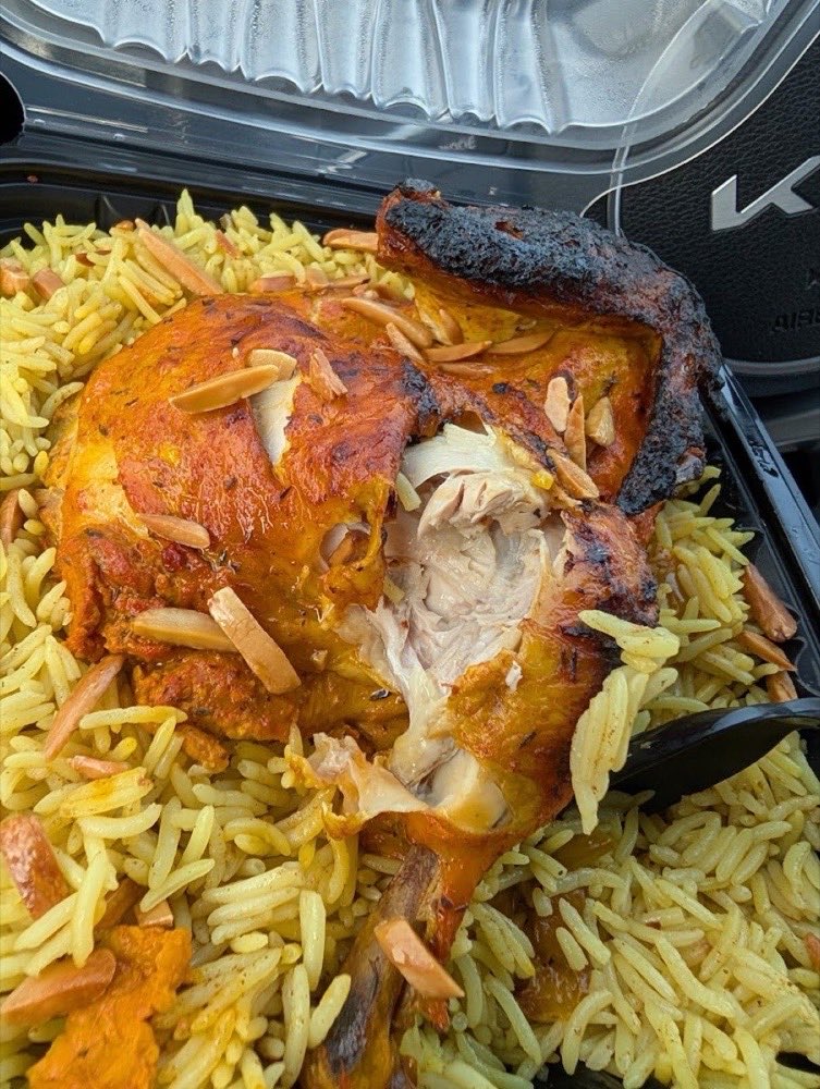A roasted quarter on saffron rice with almonds.